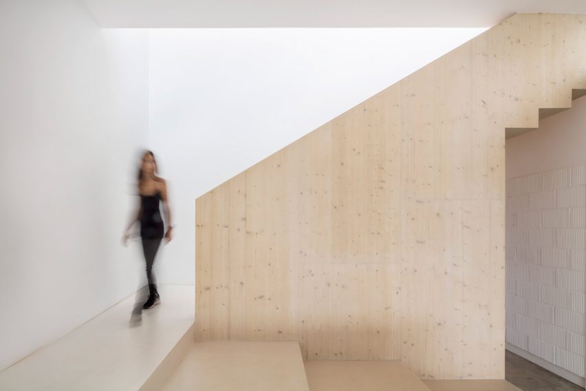 Pale wood covers the walls