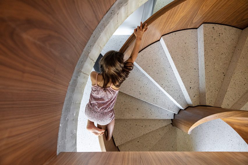 The staircase has terrazzo steps