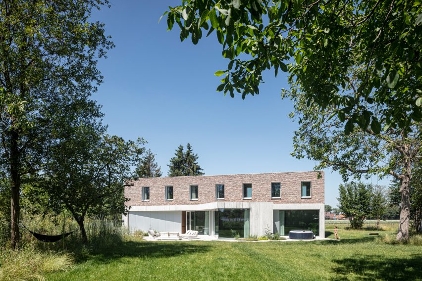 The home is nestled within plant life