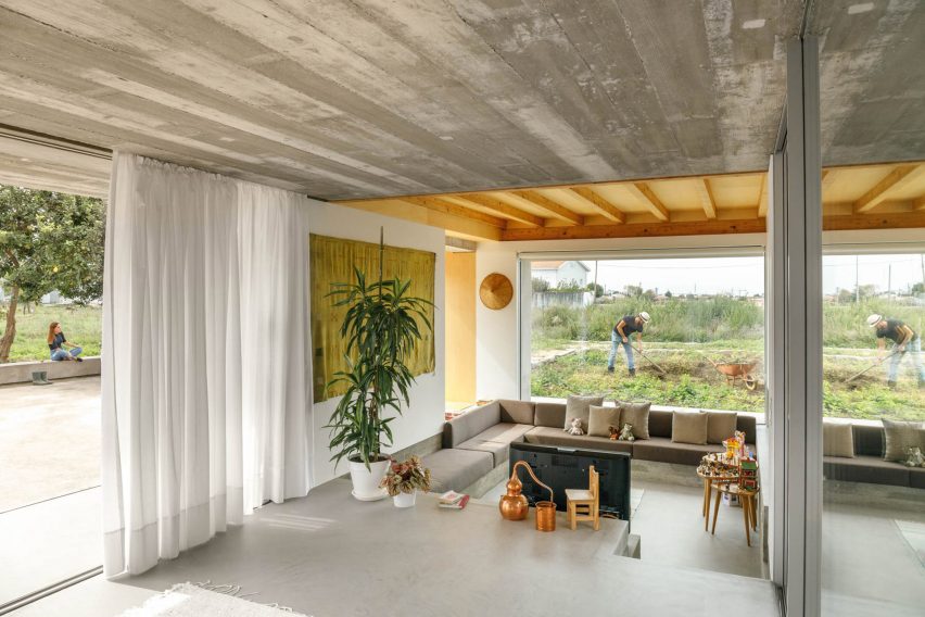 A sunken living area overlooks greenery