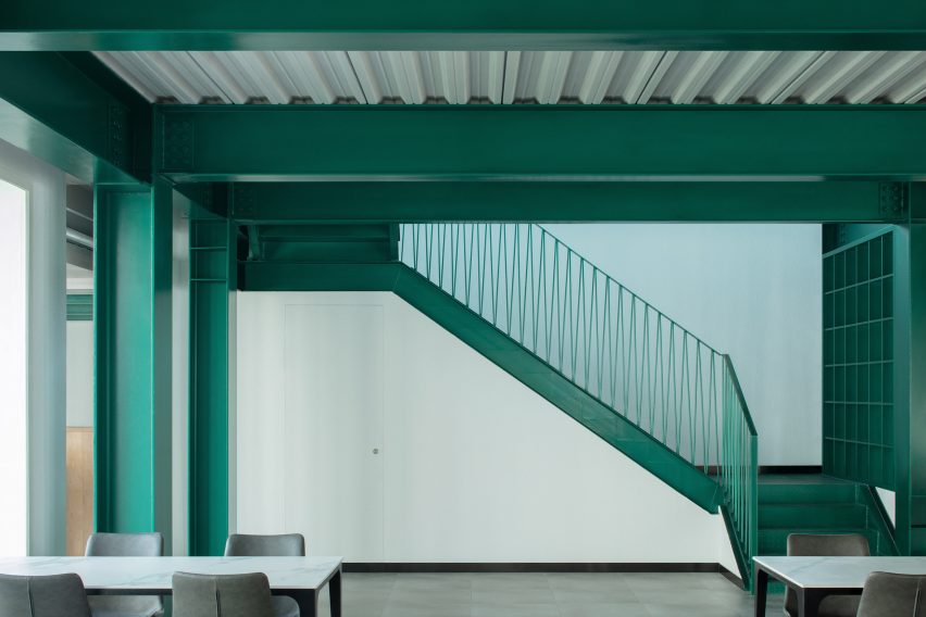 An interior with green-painted steel