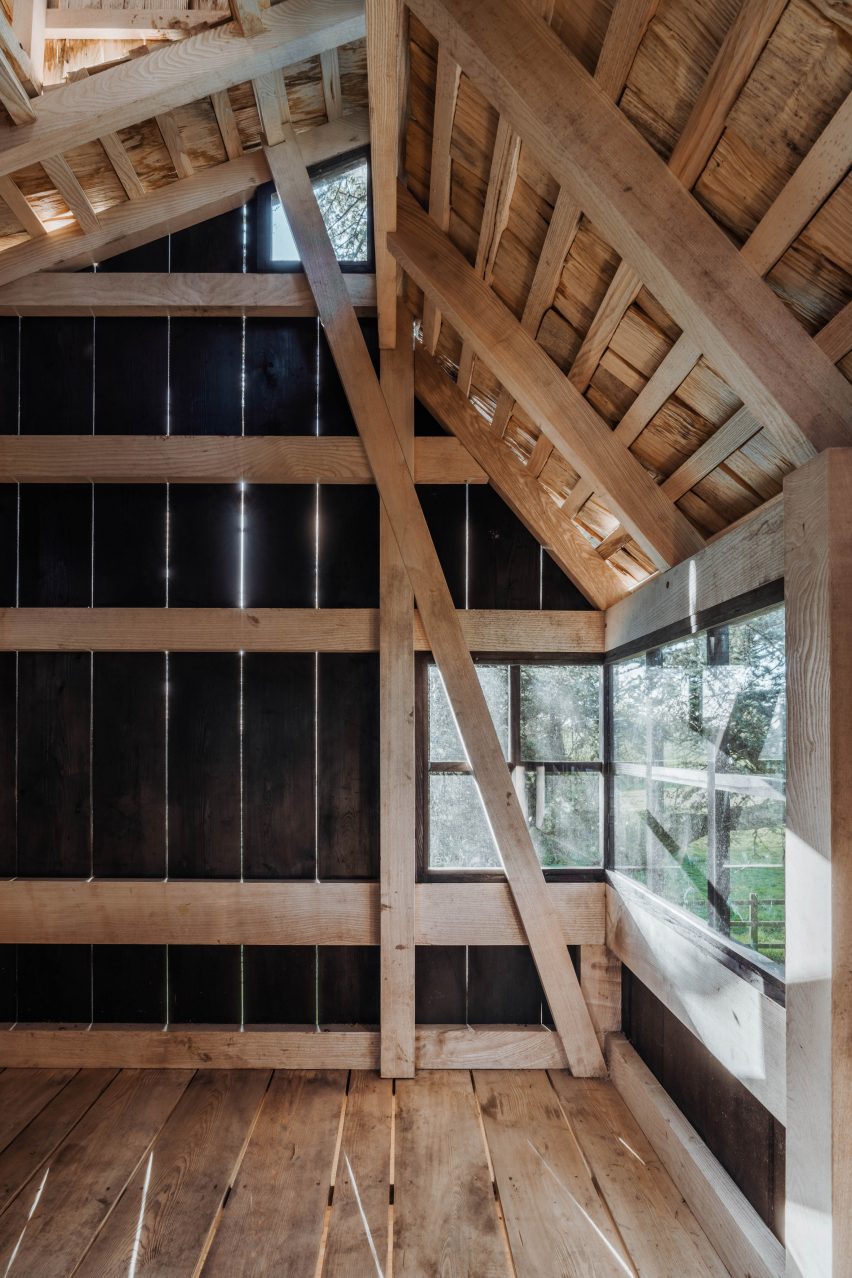 Treehouse interior showing English ash frame and scorched larch cladding