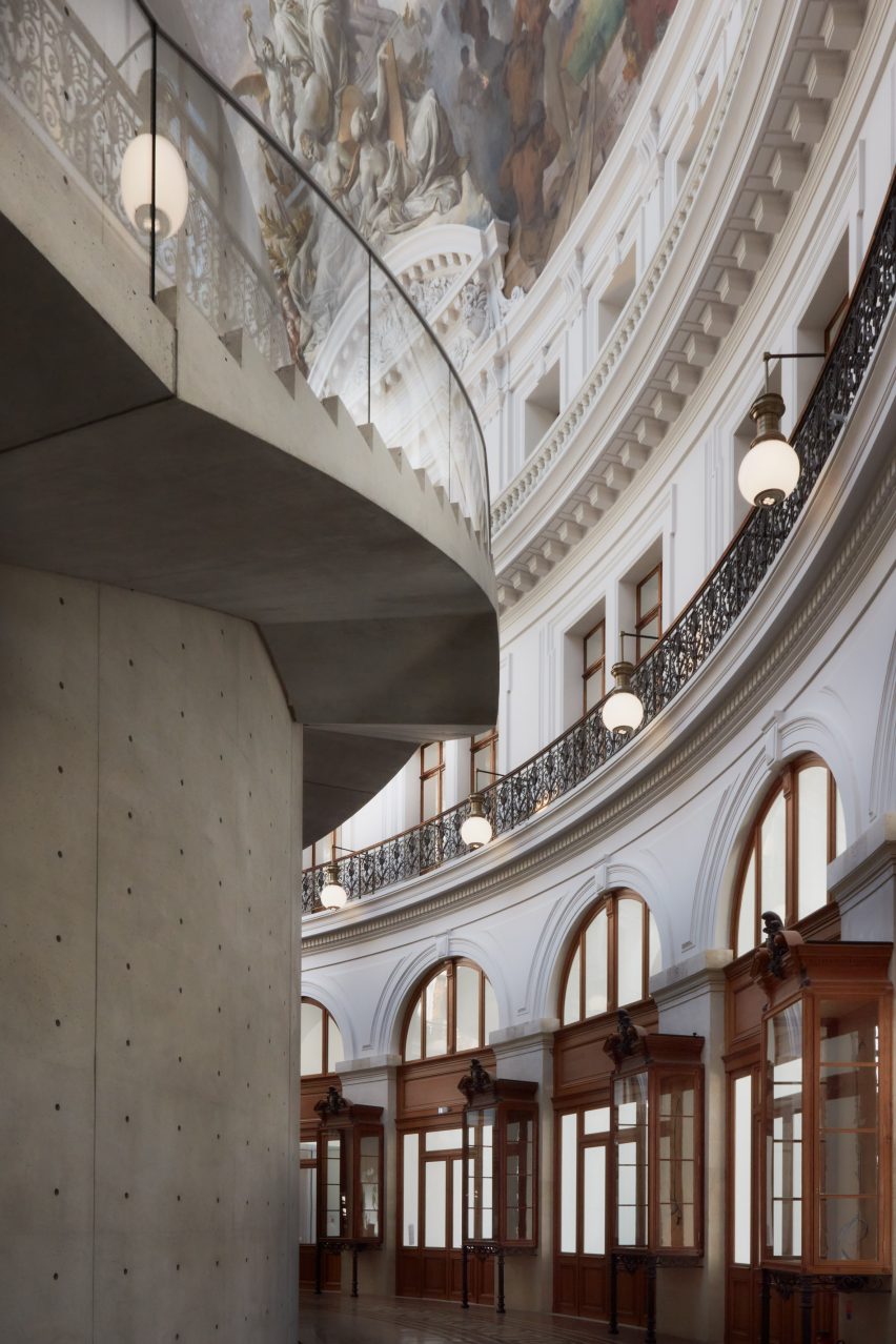 The wall was designed so that it did not interact with the existing building