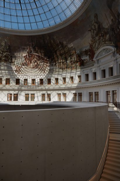Light bounces off the walls of the Bourse de Commerce