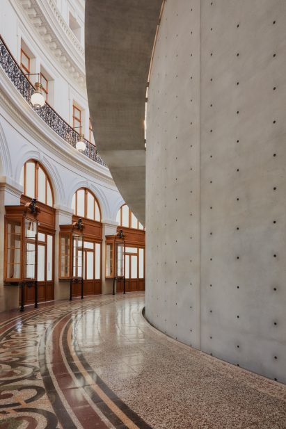 Concrete abruptly joins the decorative tiled floor