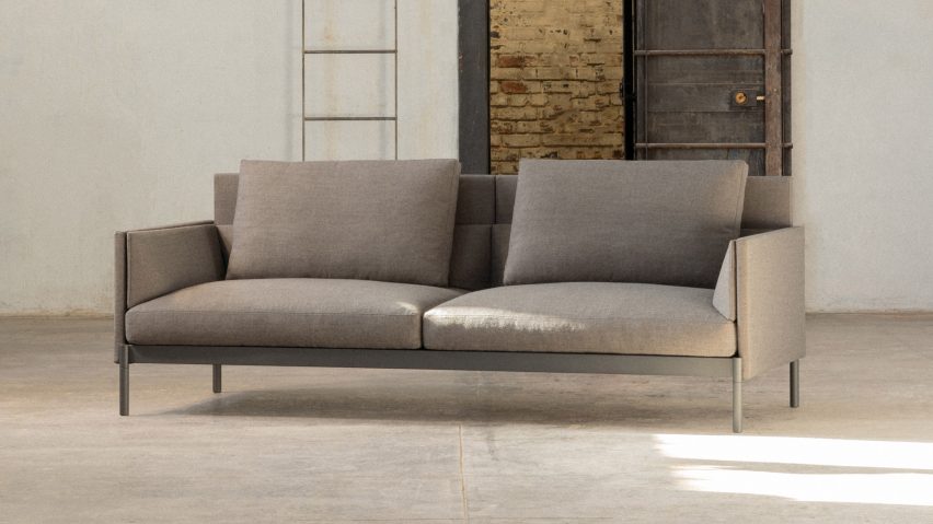 A sofa with light grey upholstery by Part & Whole