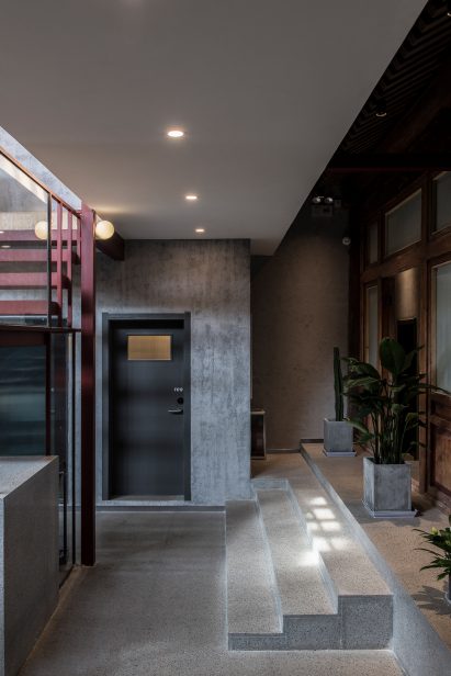 Concrete stairs to guest rooms in Well Well Well Hotel