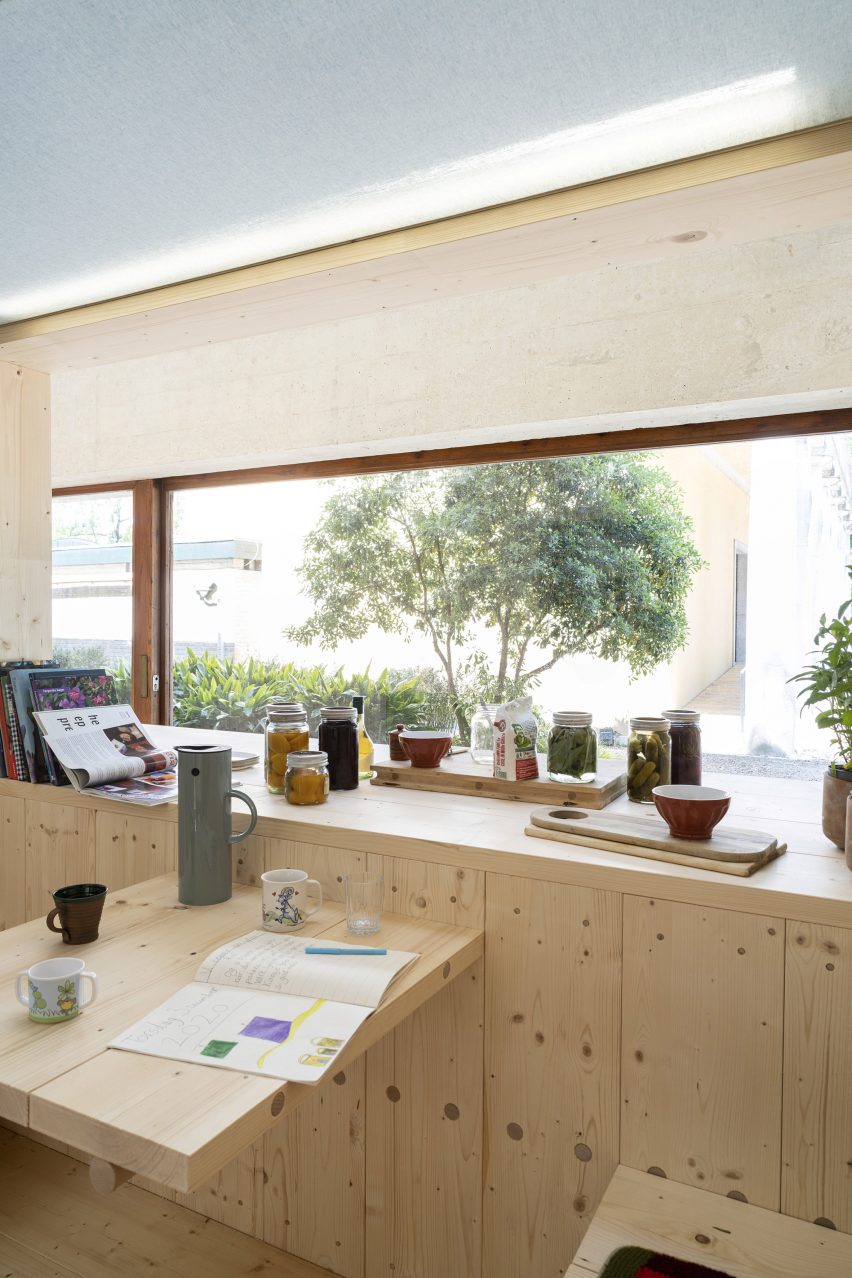 A wooden living space in the What We Share exhibition