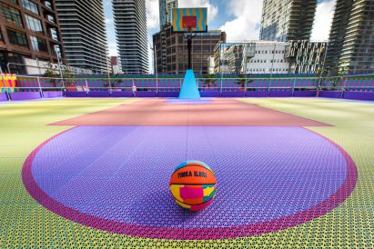 Closeup of 3D-printed sports tiles by OnCourt in purple, yellow and pnik