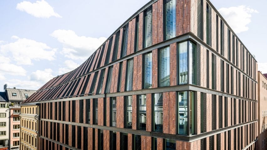 The roofline rises from the existing building
