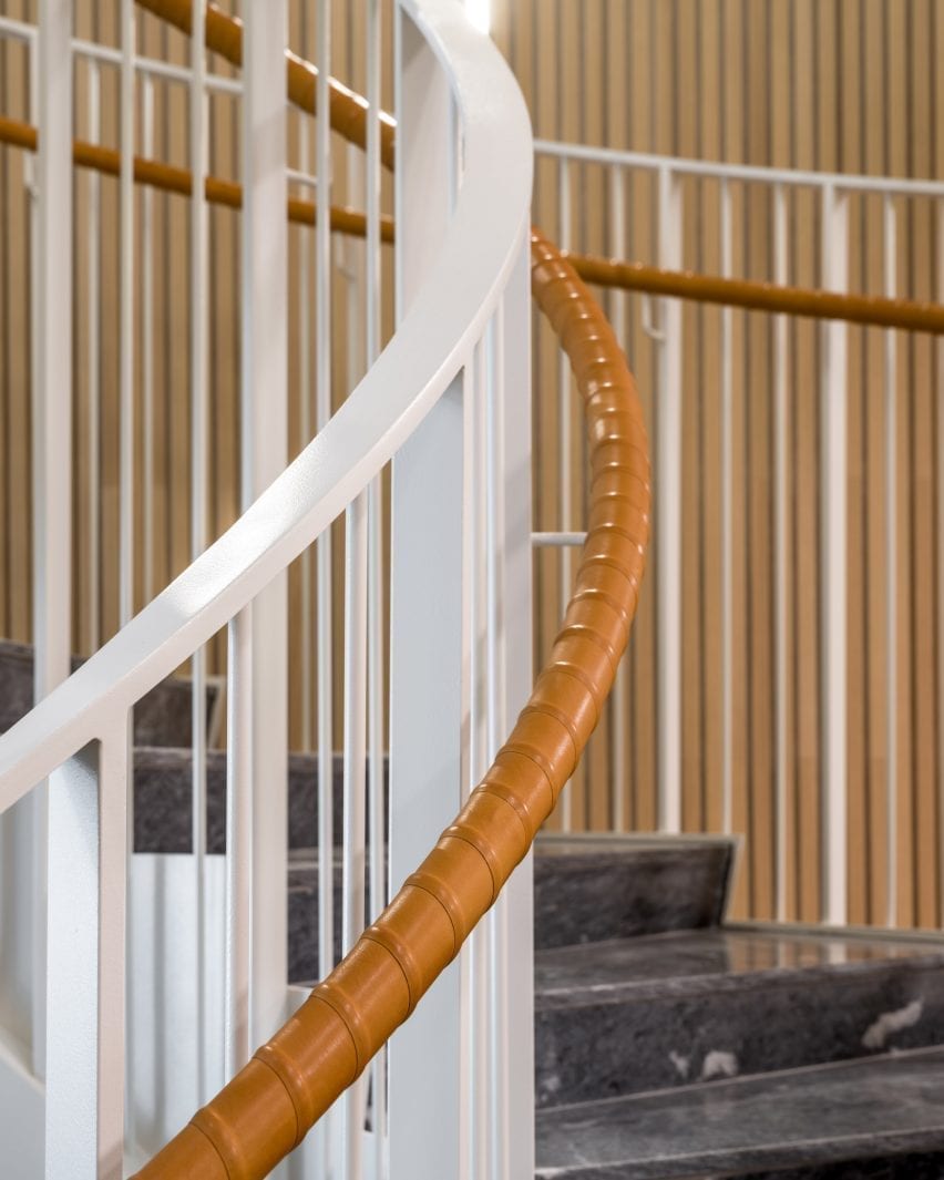 A curving bannister lines the staircase