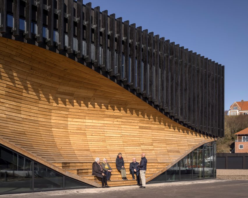 An undulating wooden facade