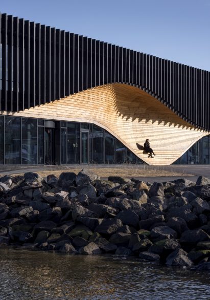A wooden facade with integrated seating