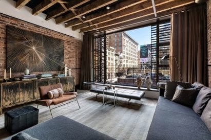 Living room with facade panels folded open