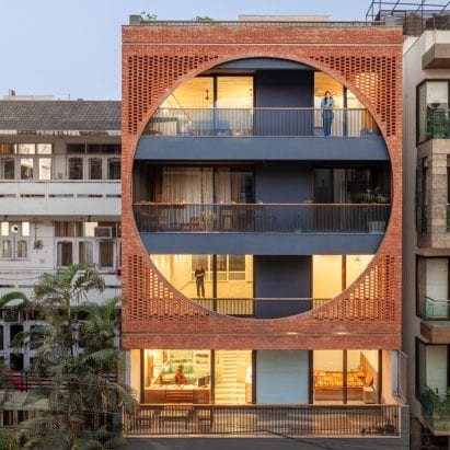 A brick screen covers the exterior of the building