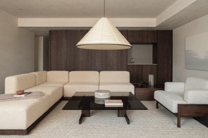 Living room with white armless sofa