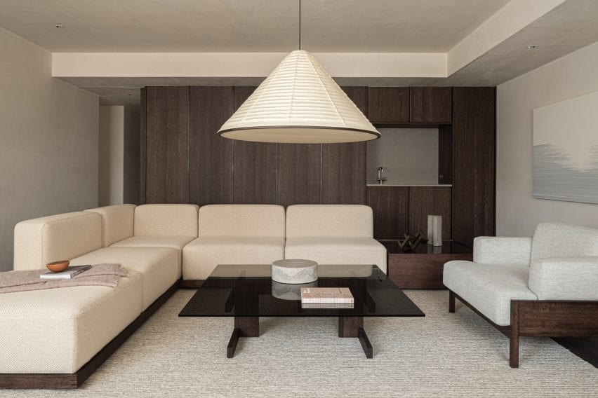 Living room with white armless sofa
