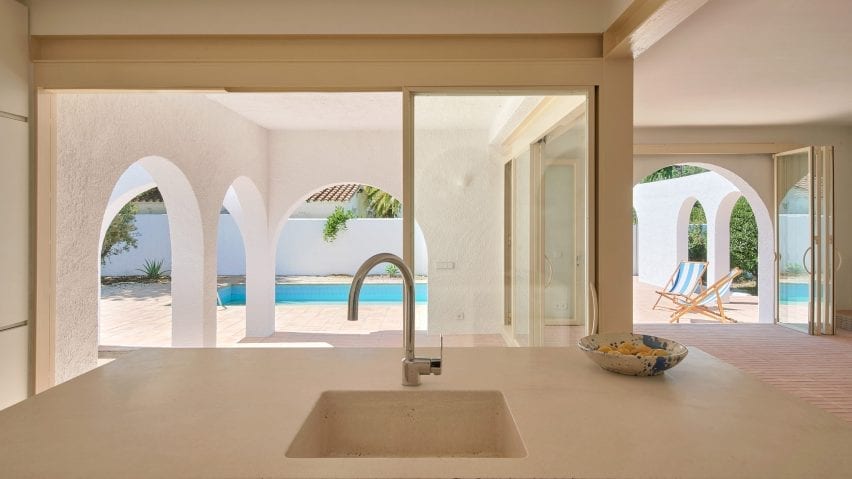 The kitchen overlooks outdoor spaces