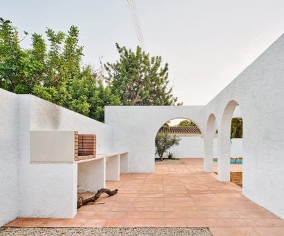 White arches surround a grill at Las 3 Marías