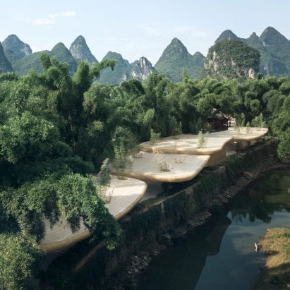 The pavilion is located near mountains