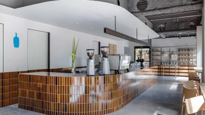Curving counter with brown tiles in Blue Bottle Coffee Shibuya