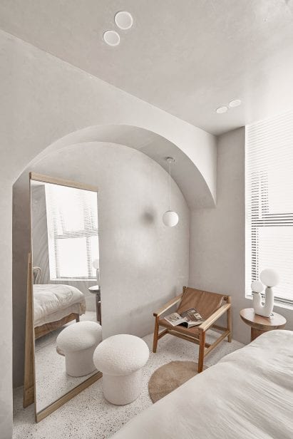 Textural paint covers the walls of Brown Box apartment