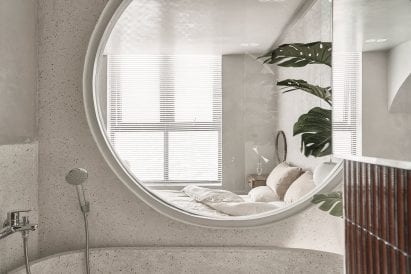 A terrazzo bathtub was placed in the en-suite