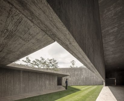 A covered walkway opens onto a courtyard