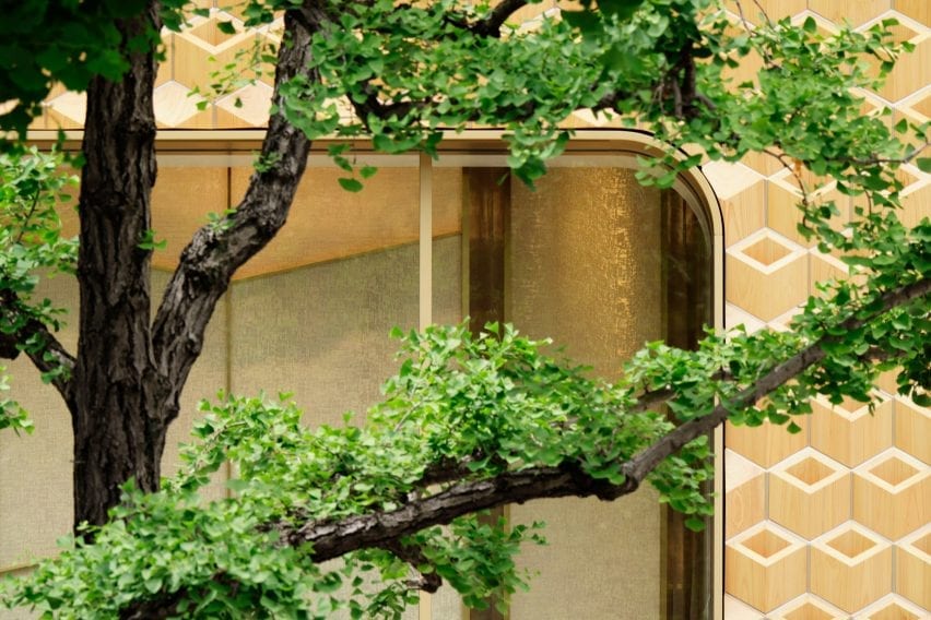 Windows are framed by golden details