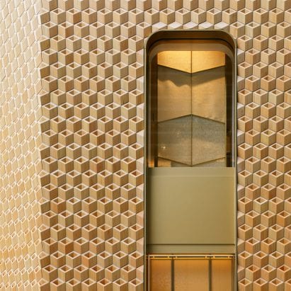 It has a golden hue to the facade