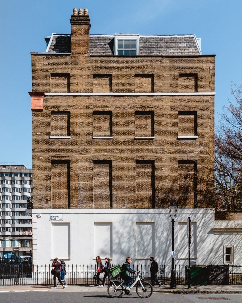 A windowless facade of London housing