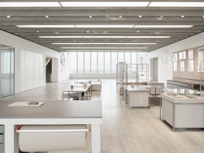 Overview of shop interior by Daytrip with simple grey display tables