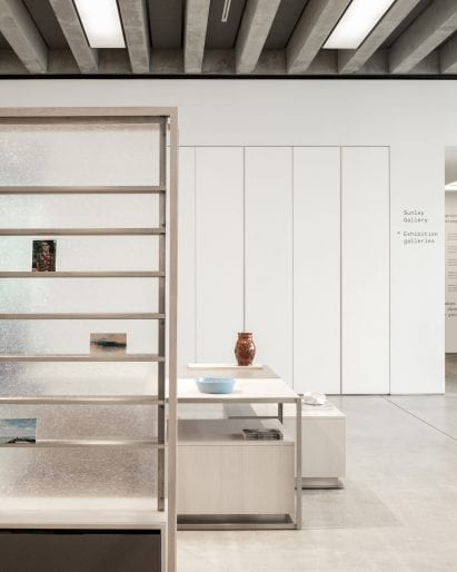 Magazine display and low tables with vases in Turner Contemporary Store