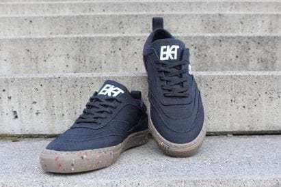 A pair of black Alchemy-X trainers