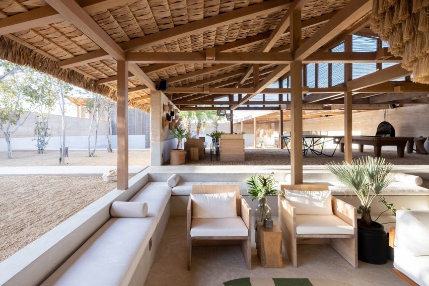 Estudio ALA designs El Perdido Hotel with rammed earth walls and thatched roofs