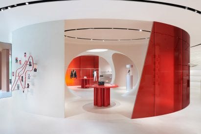 Concrete and red glass perimeter walls in Ferrari Maranello store