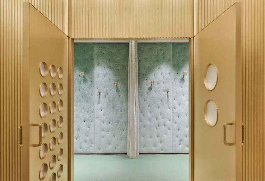 Double doors open to a fitting room