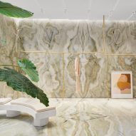 A bench is placed a top onyx floors