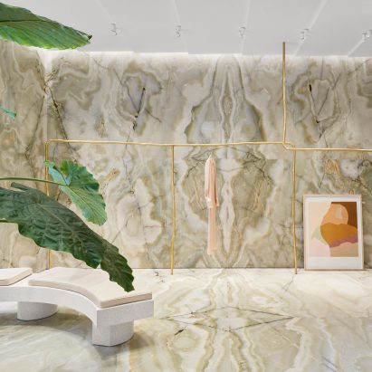 A bench is placed a top onyx floors
