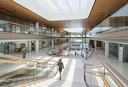 A grand staircase stretches between floors at the PGA Tour headquarters