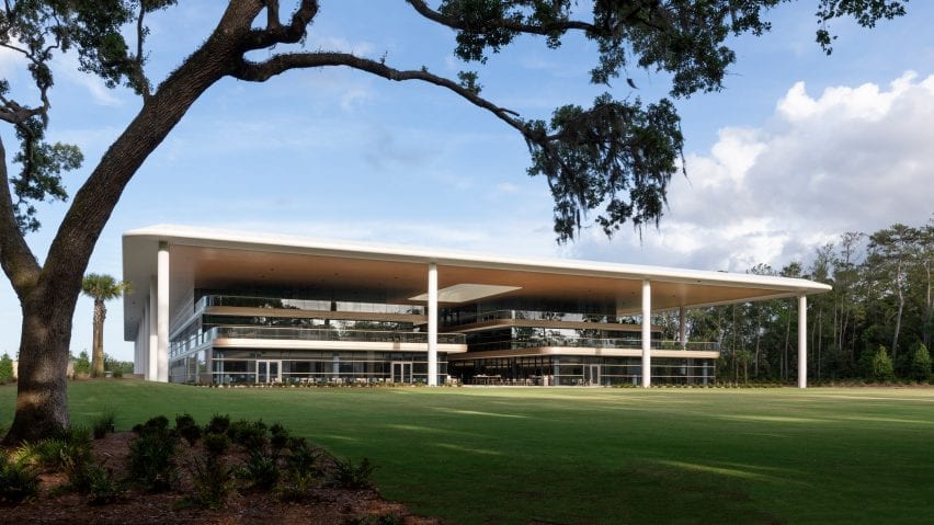 The building is surrounded by golf courses