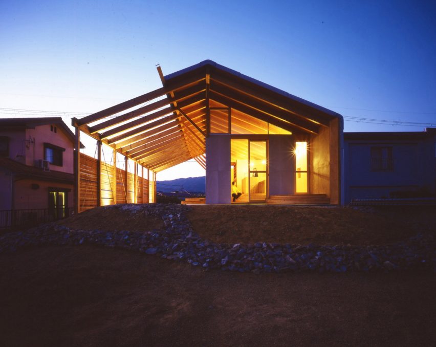 Exterior of timber framed house lit up at nighttime