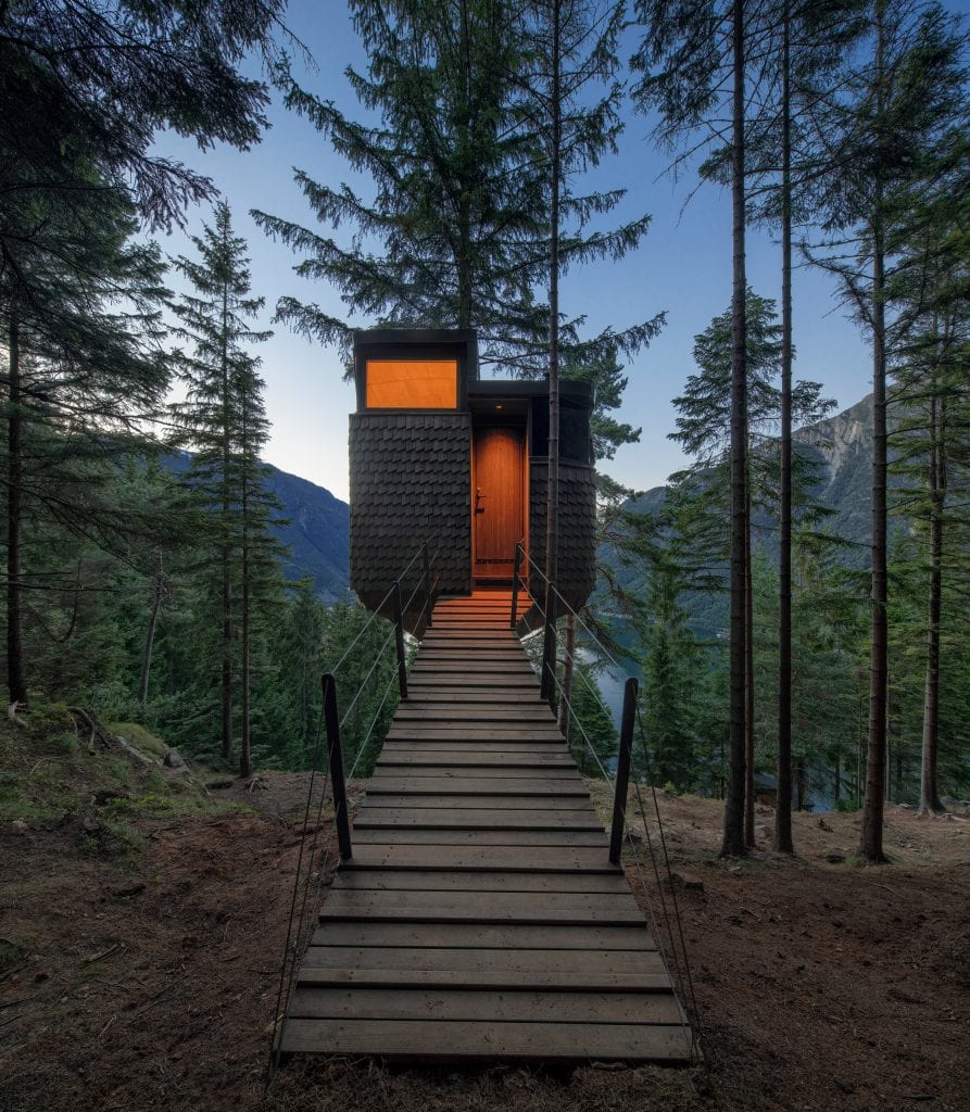 A wooden footbridge marks the entrance