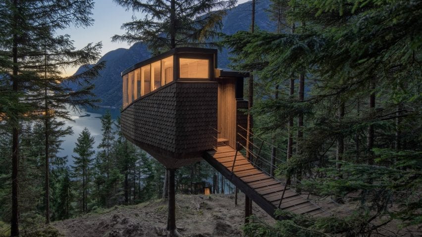 A raised walkway leads to to the treehouse