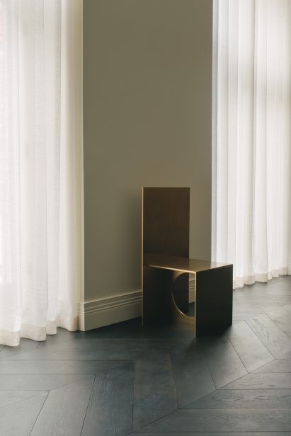 Gold-coloured chair in London office by Hollie Bowden