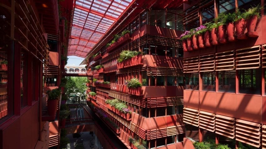 Plants line the walls of the building