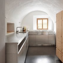L-shaped kitchen beneath a rounded ceiling