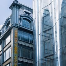A historic and undulating glass facade