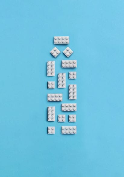White lego bricks arranged in the shape of a bottle