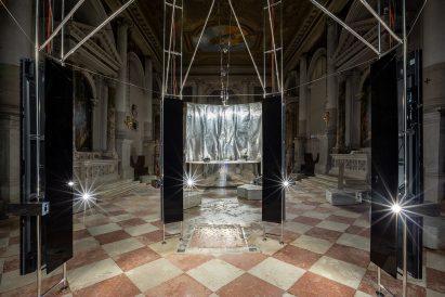 Screens line the edge of the 3D scanner at Planet of People
